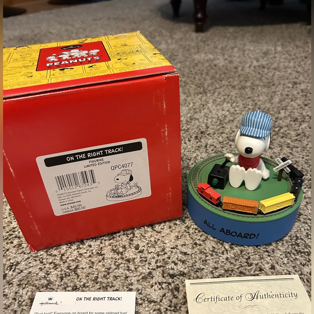 Hallmark Snoopy Figurine with Blue Base and Multi-Colored Train new boxed